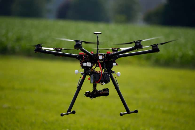FILE - In this June 11, 2015, file photo, a hexacopter drone is flown during a drone...
