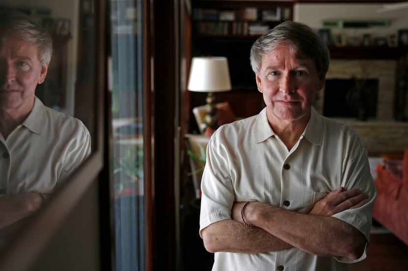 Author Ben Fountain poses for a photograph in a living room at his Dallas home on July 23,...