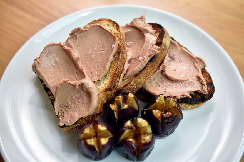 Crostini with chicken liver mousse and roasted figs. 