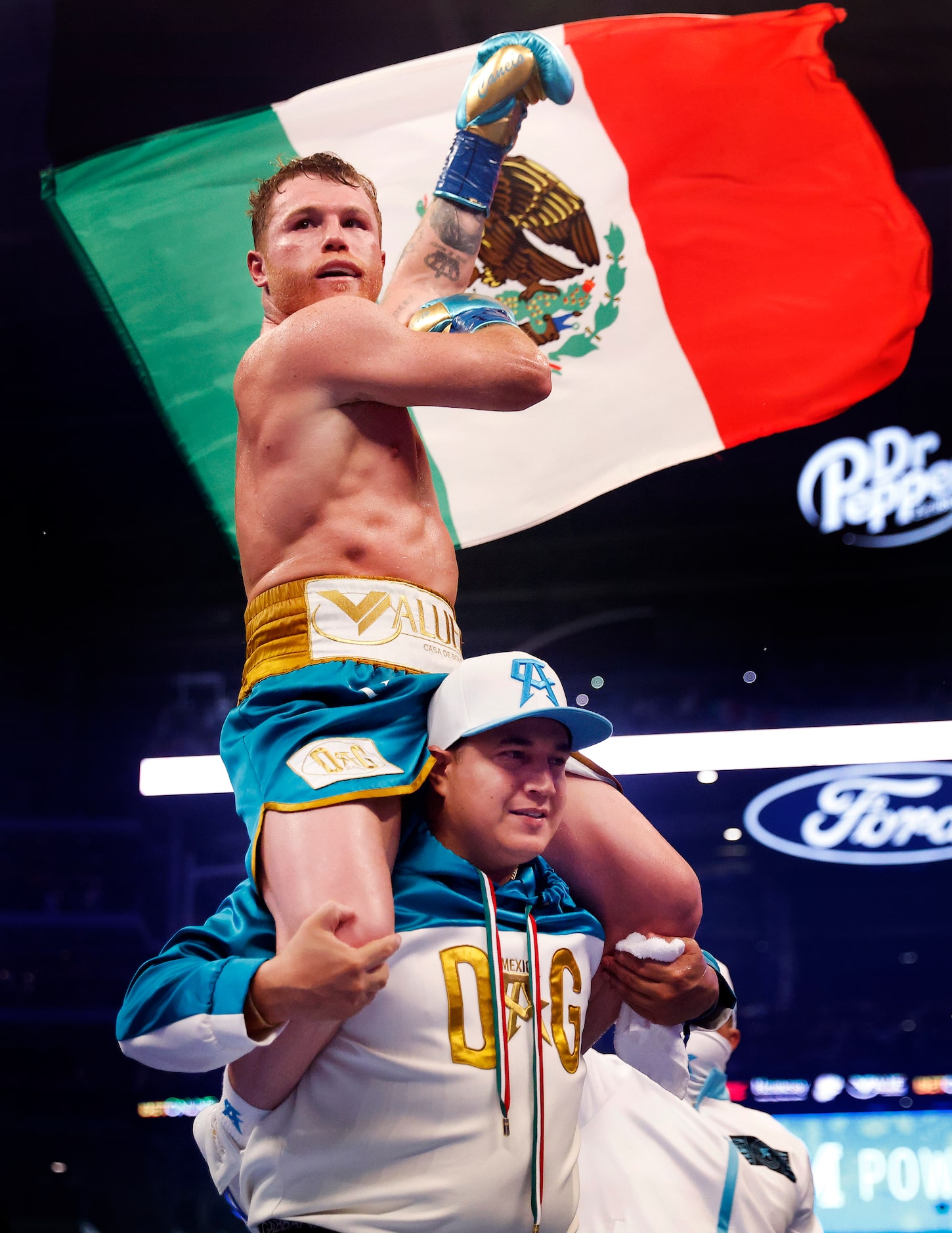 Boxers Canelo Alvarez celebrates after defeating Billy Joe Saunders in the eighth round of...