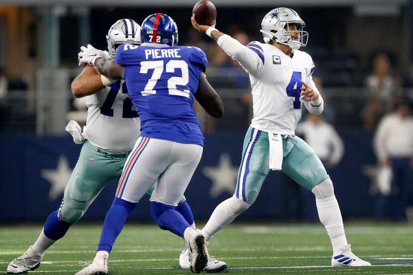 Dallas Cowboys quarterback Dak Prescott (4) throws a fourth quarter pass against the New...