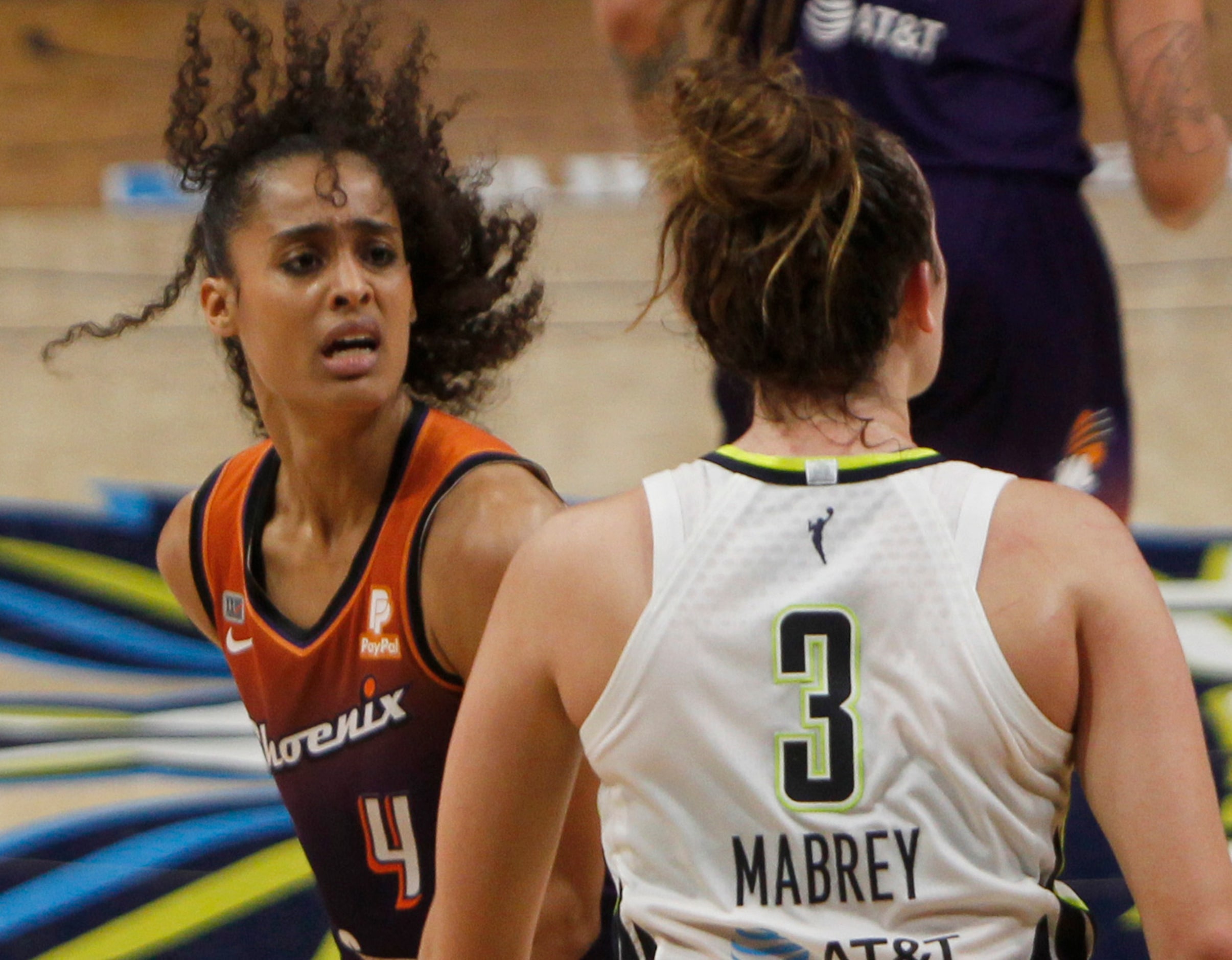 Phoenix guard Skylar Diggins-Smith (4) has some words for Dallas guard Marina Mabrey (3)...