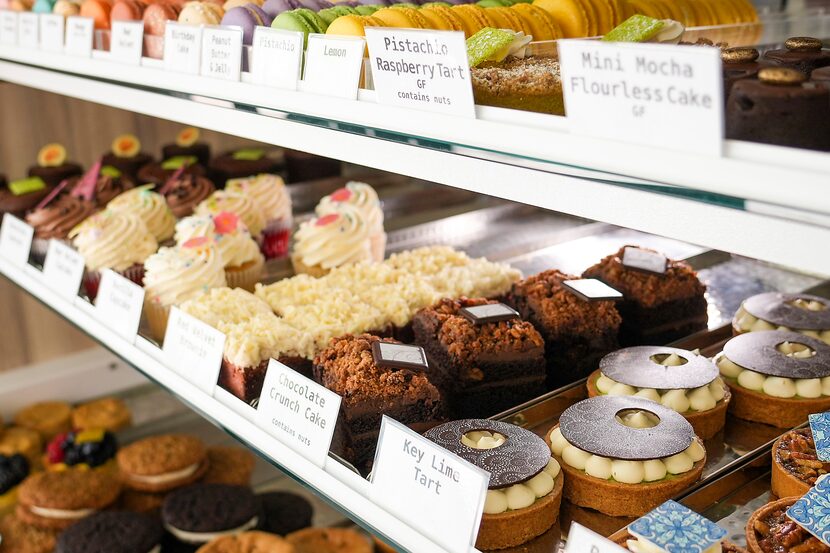 Cakes, cookies, tarts and macrons in a display case at Haute Sweets Patisserie in Hillcrest...