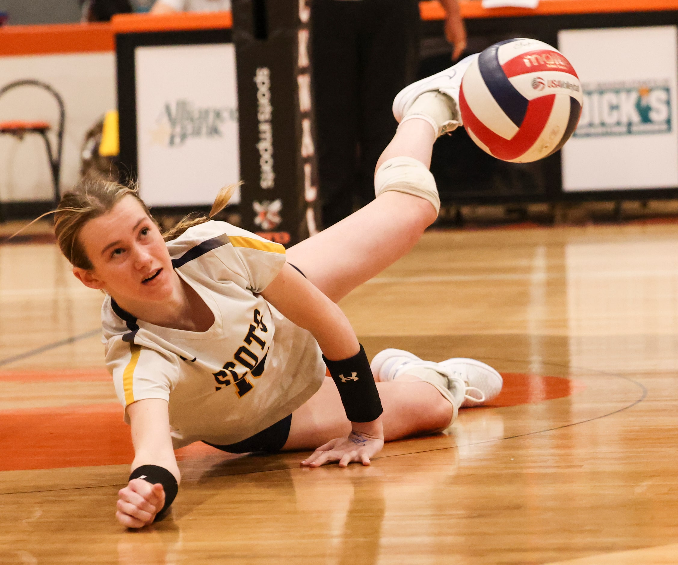 Highland Park High School’s Nicole Mauser dives, attempting to save the volley during the...