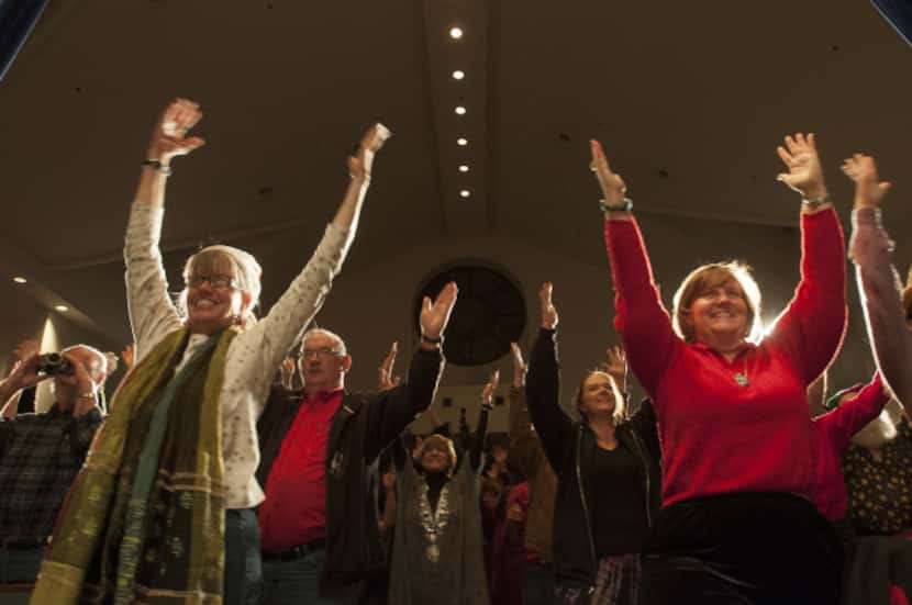 Winter solstice celebrants were led in standing yoga postures at the Cathedral of Hope on...
