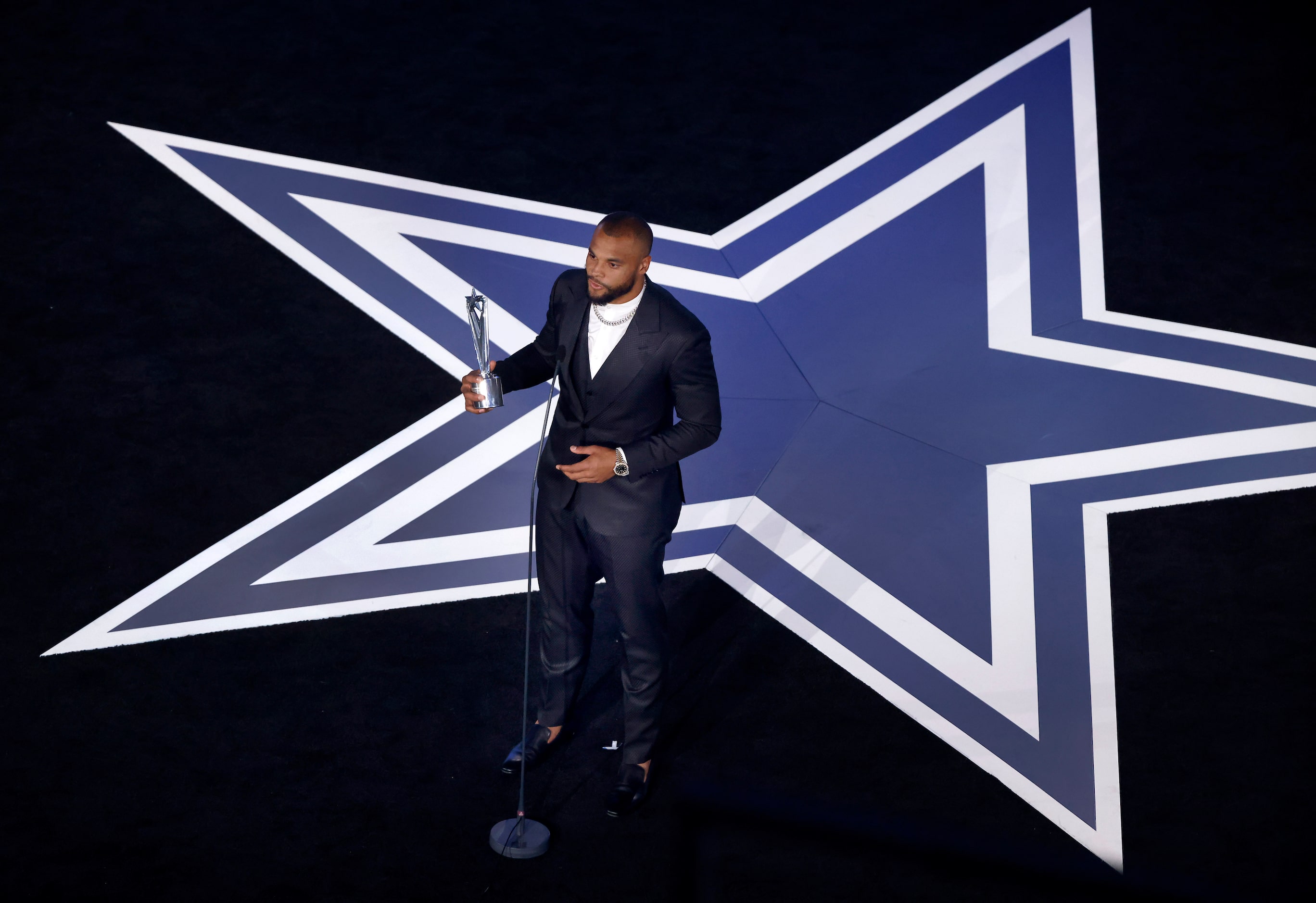 Dallas Cowboys quarterback Dak Prescott speaks after receiving the Beyond the Gridiron Award...