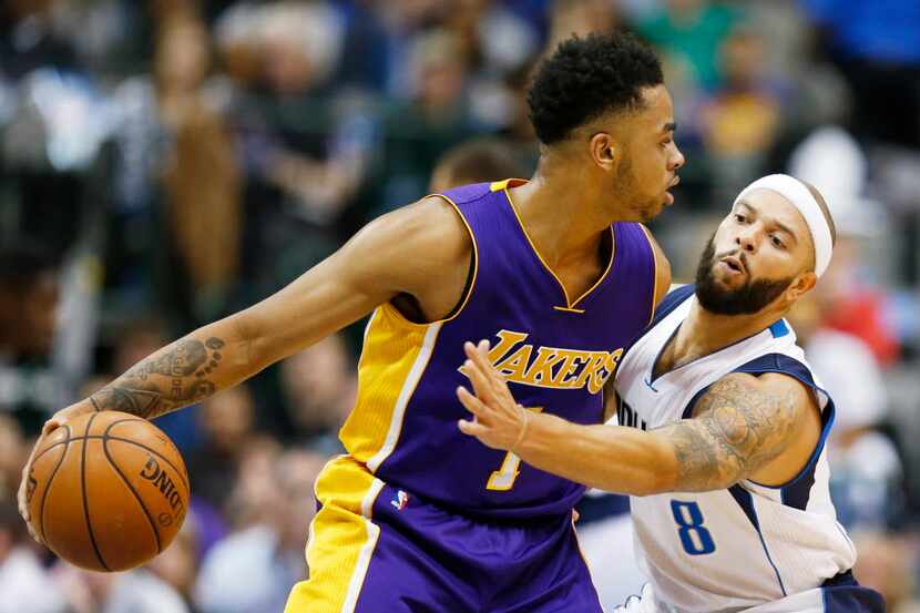 Dallas Mavericks guard Deron Williams (8) attempts to steal the ball from Los Angeles Lakers...