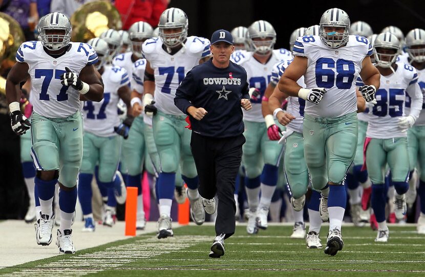 Cowboys head coach Jason Garrett leads his team on to the field against the Baltimore Ravens...