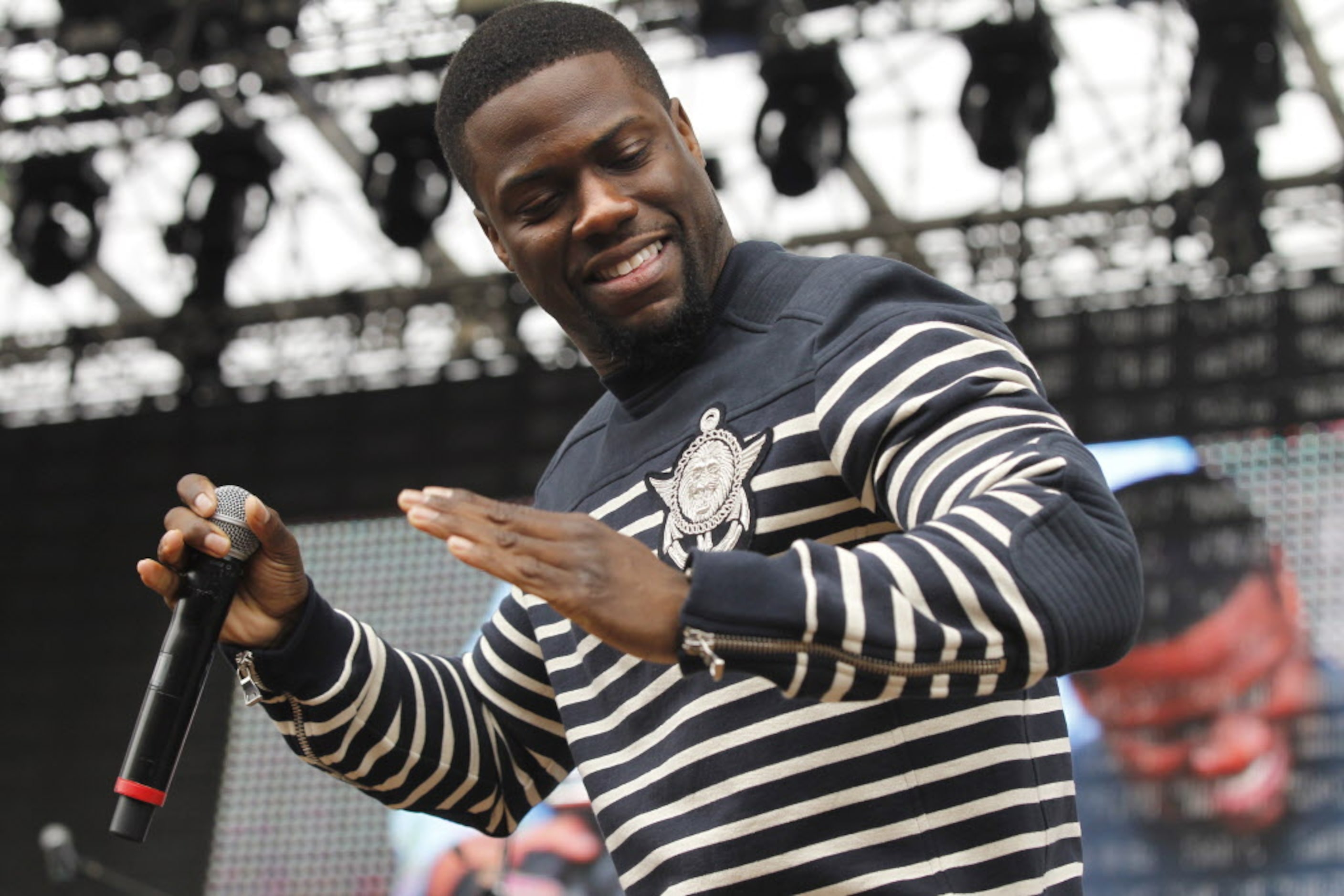 Kevin Hart daces the robot before LL Cool J went on stage during the March Madness Music...