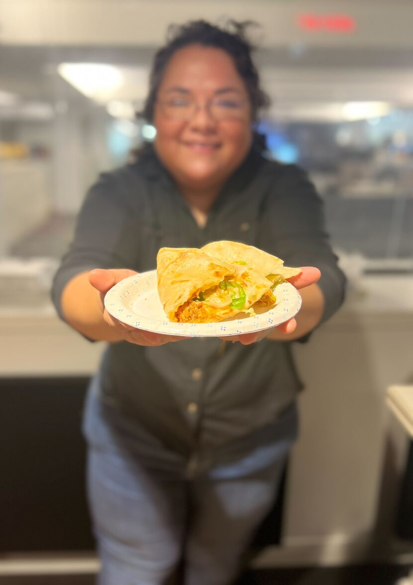 Imelda Garcia holds two styles of quesadillas from Tortas Revolucion in Dallas. Cheese or no...