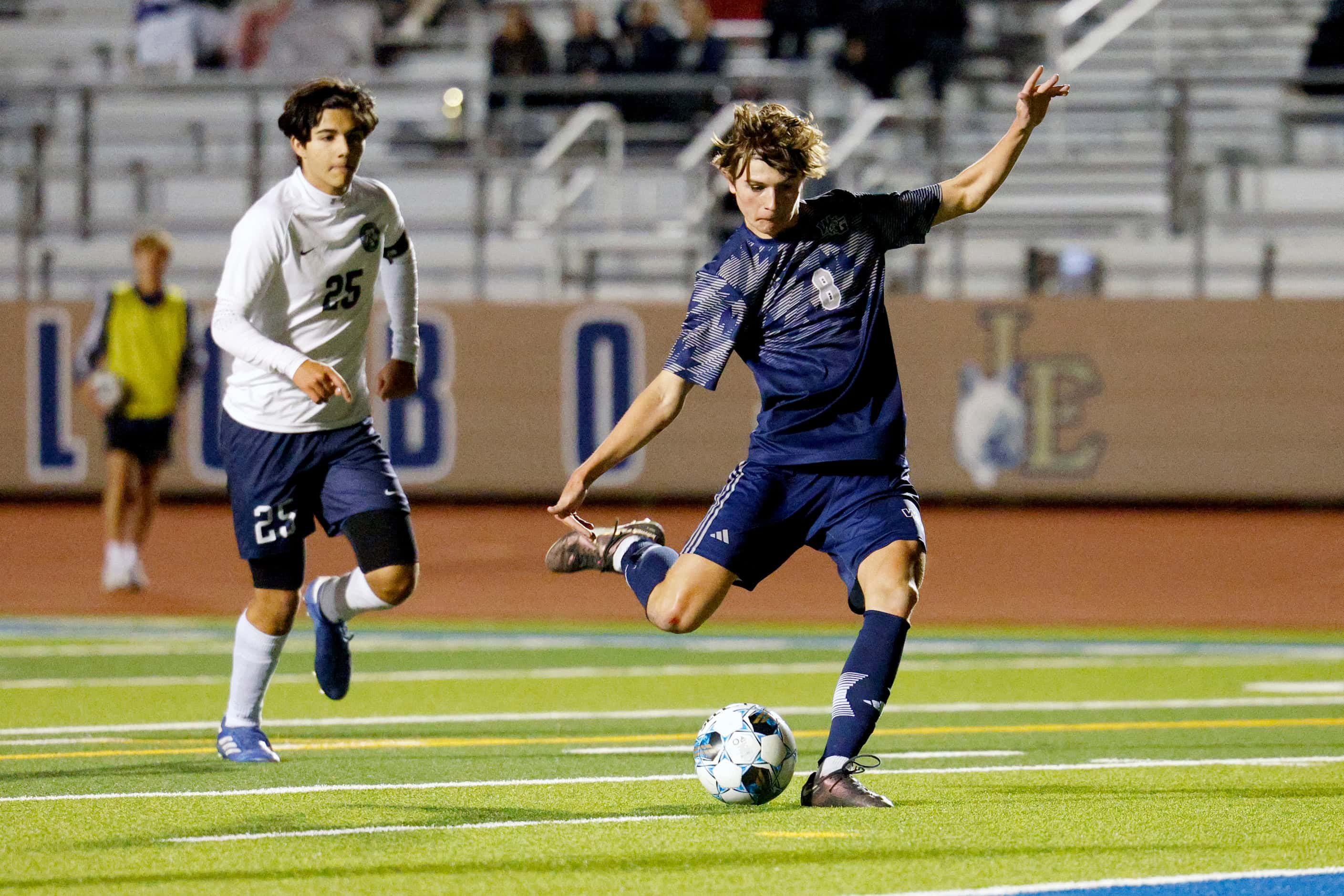 Prosper Walnut Grove midfielder Mason Kutch (8) shoots the ball ahead of Frisco Reedy's...