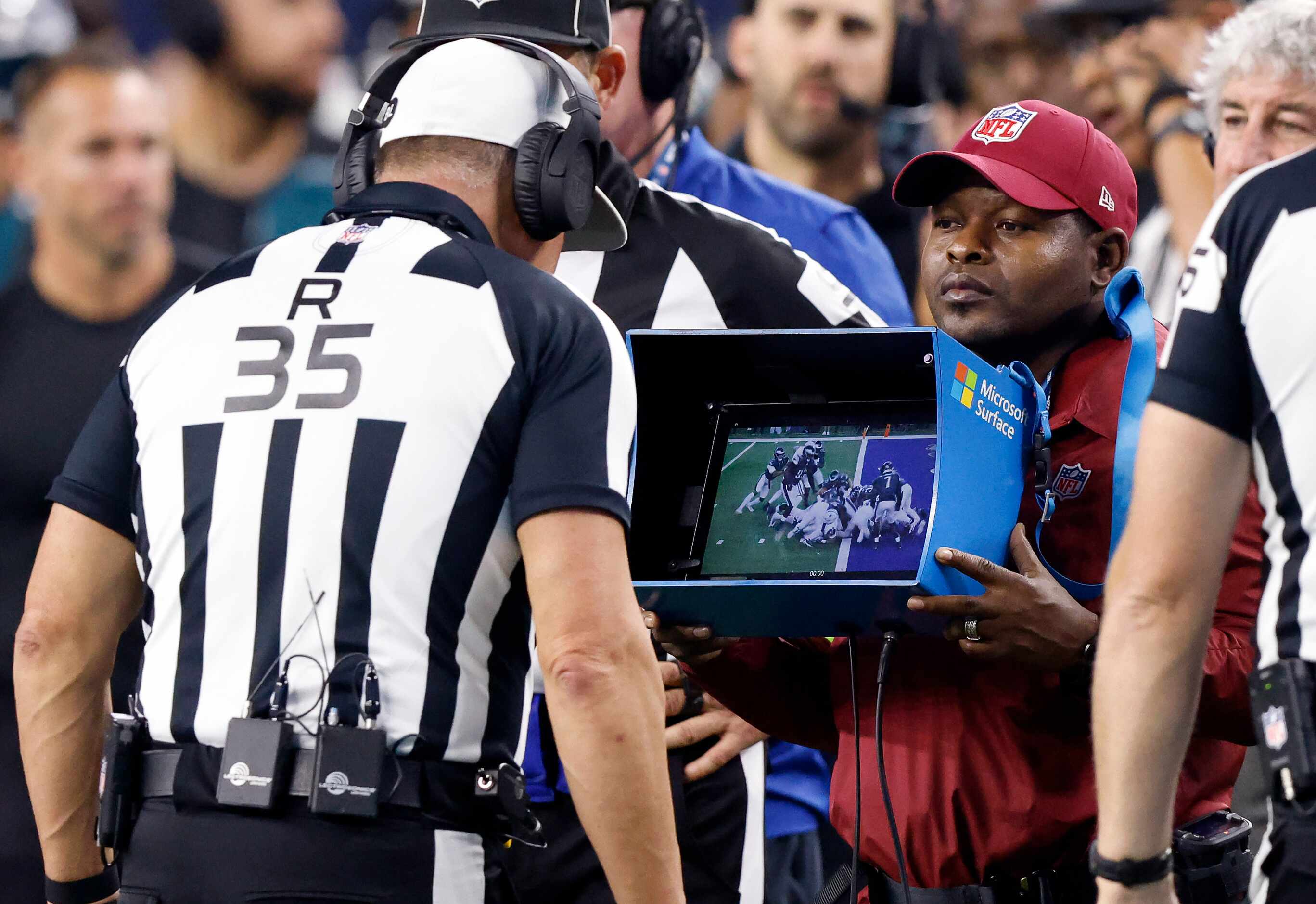 Referee John Hussey (35) reviews Dallas Cowboys running back Tony Pollard’s second quarter...