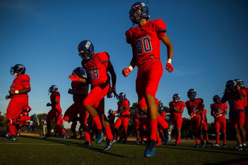 Duncanville warms up before a high school football game between Lancaster and Duncanville on...