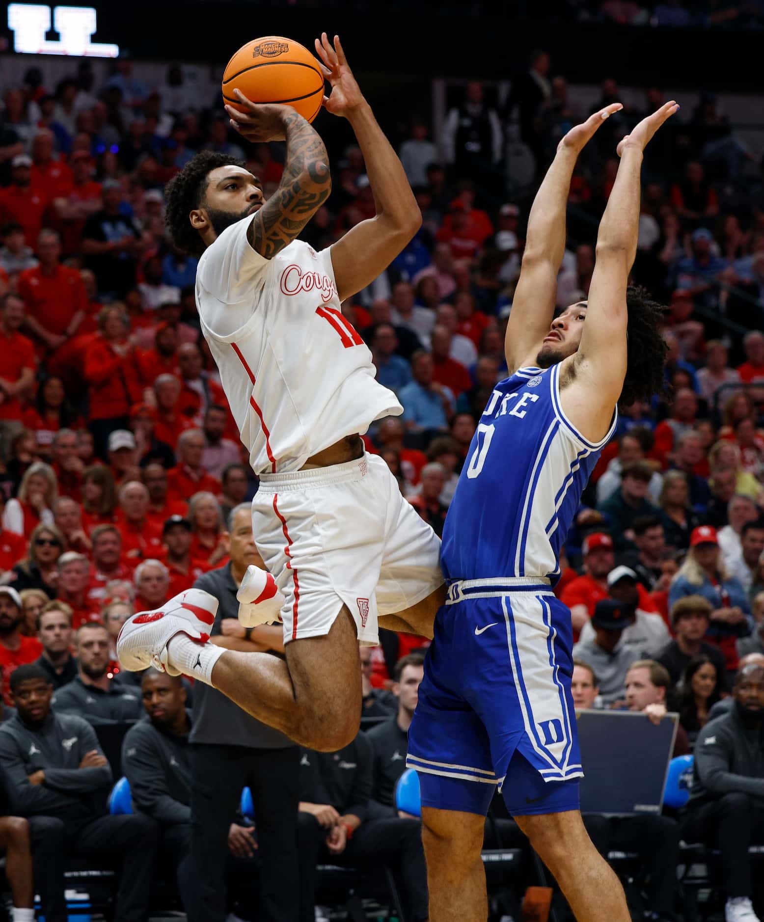Houston guard Damian Dunn (11) shoots over Duke guard Jared McCain (0) during the second...