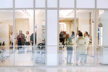 People take a tour of the new Science & Engineering Innovation & Research (SEIR) building on...