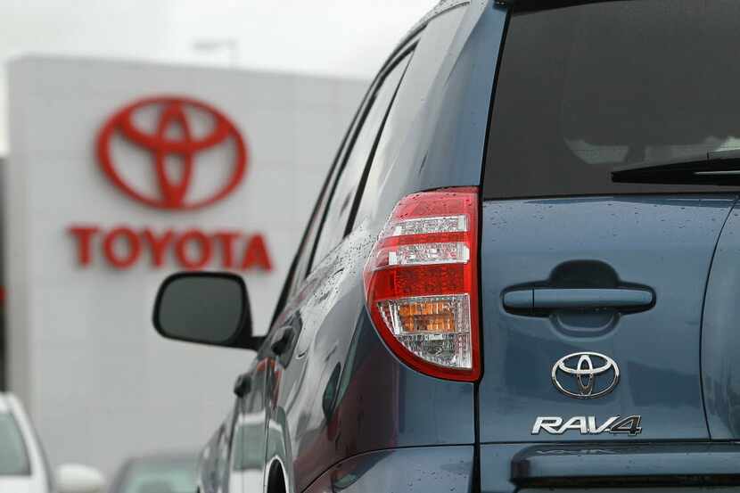 A Toyota RAV4 sits on the sales lot at a Toyota dealership in Oakland, California. (Photo by...