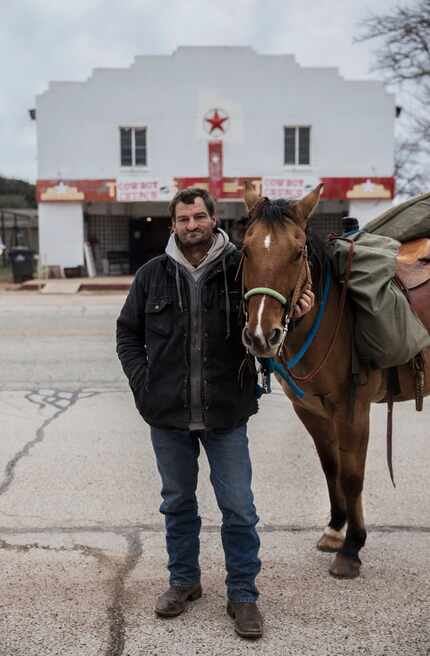 Jerry Andrews, of Friendship, Okla., and his horse Speck at Coke County Cowboy Church in...