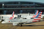 American Airlines planes are seen at the gates of Terminal C at DFW Airport on Monday, Feb....