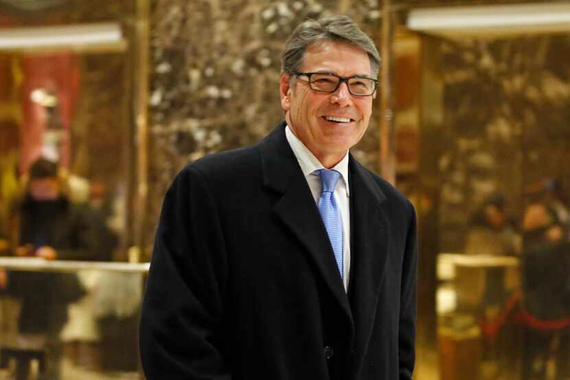 In this Dec. 12, 2016, photo, former Texas Gov. Rick Perry smiles as he leaves Trump Tower...