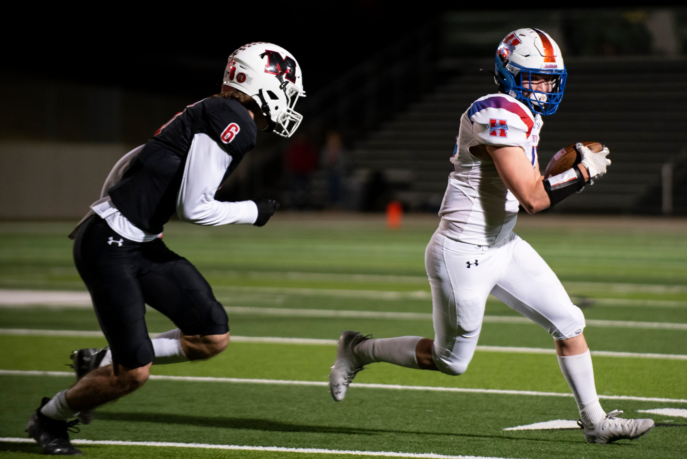 Midlothian Heritage junior Colton Kyle (12) looks to avoid Melissa senior Ryan Johnson (6)...