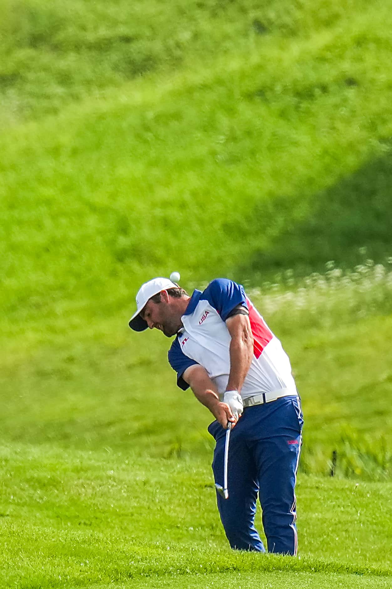 Scottie Scheffler of the United States hits from the 18th fairway during the final round of...