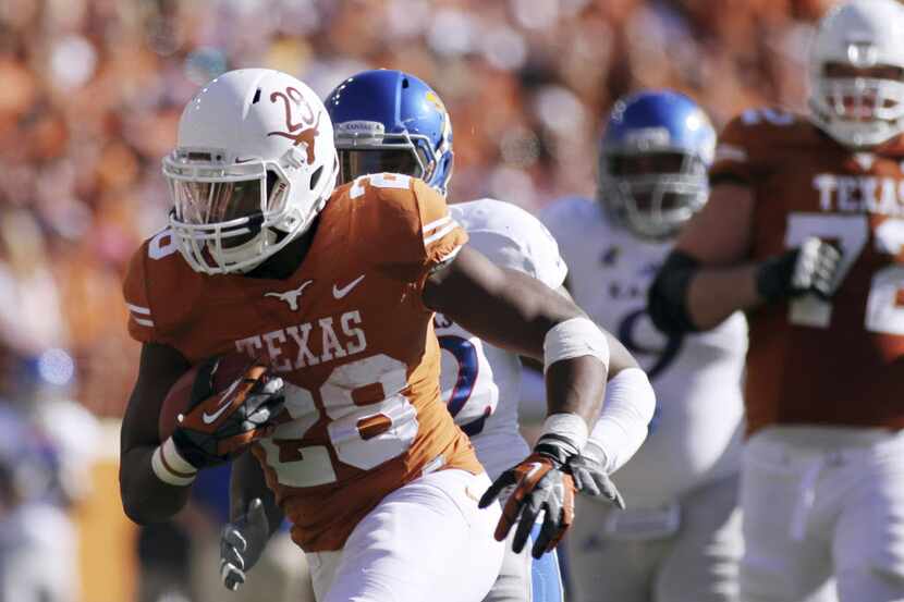 Longhorn back Malcolm Brown rushed for a career-high four touchdowns against Kansas, during...