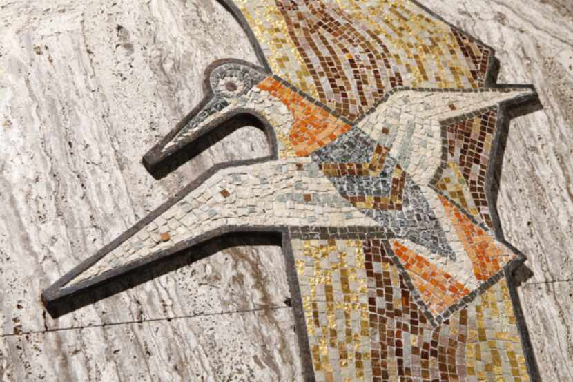 The mosaic Birds in Tree shown in its original context, prior to removal, on the second...