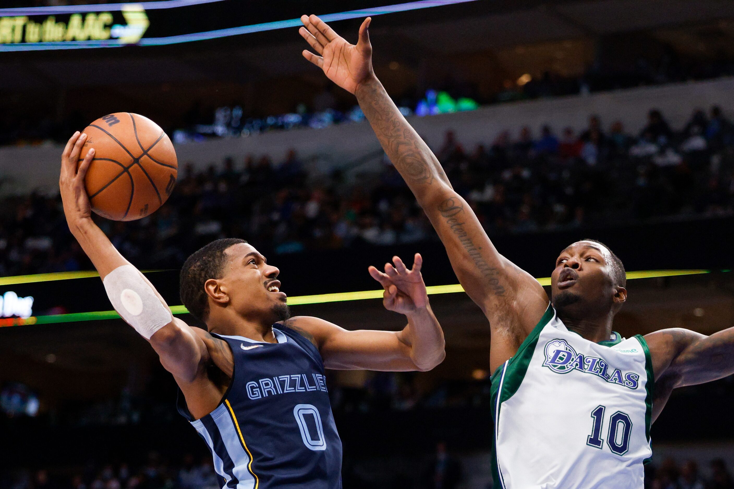 Dallas Mavericks forward Dorian Finney-Smith (10) tries to block a shot from Memphis...