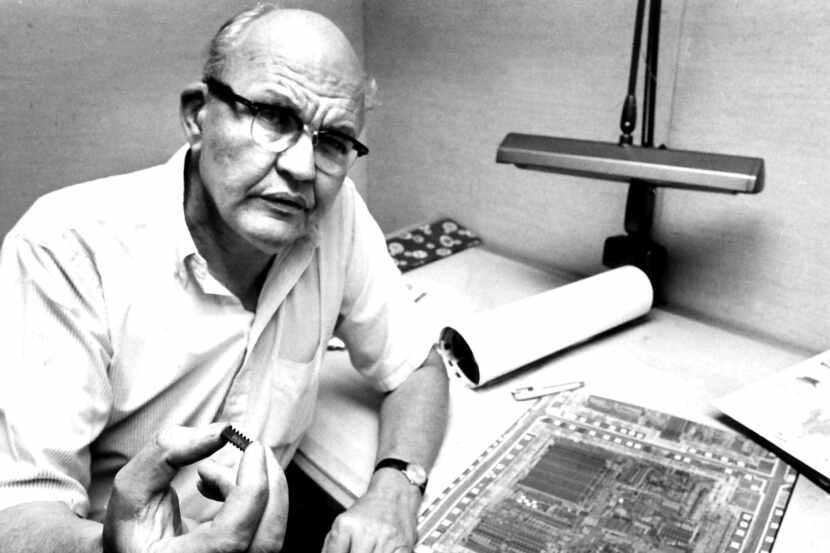 8/19/1982 --- Jack Kilby holds an integrated circuit in his right hand that contains a...