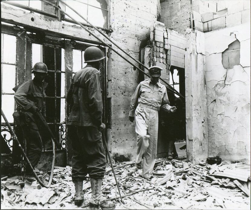 Gen. Douglas MacArthur returns to the ruins of his home atop the once-luxurious Manila Hotel...