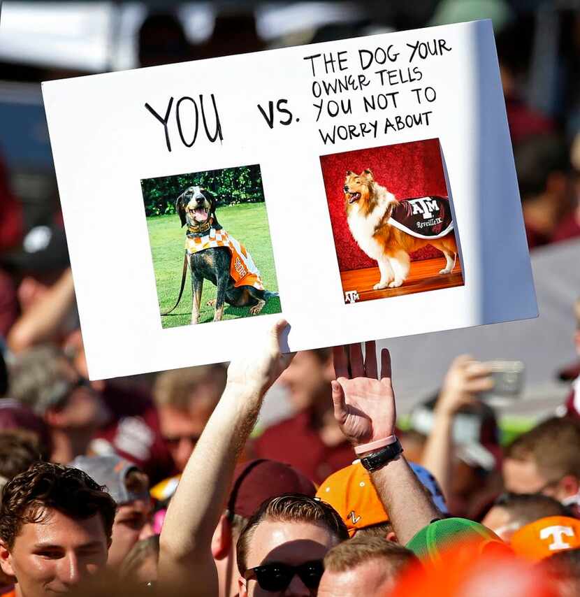 A college football fan holds a sign during the College Gameday show prior to the Texas A&M...