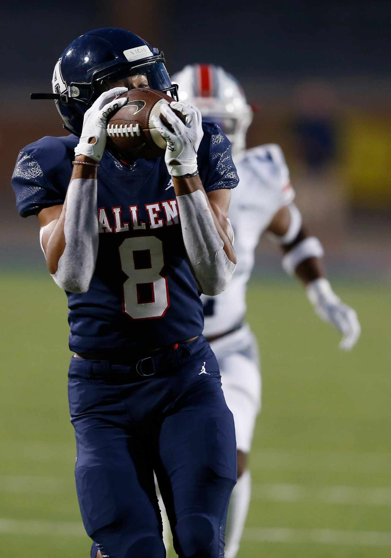 Allen's Blaine Green (8) catches a pass for a touchdown in front of Humble Atascocita's...