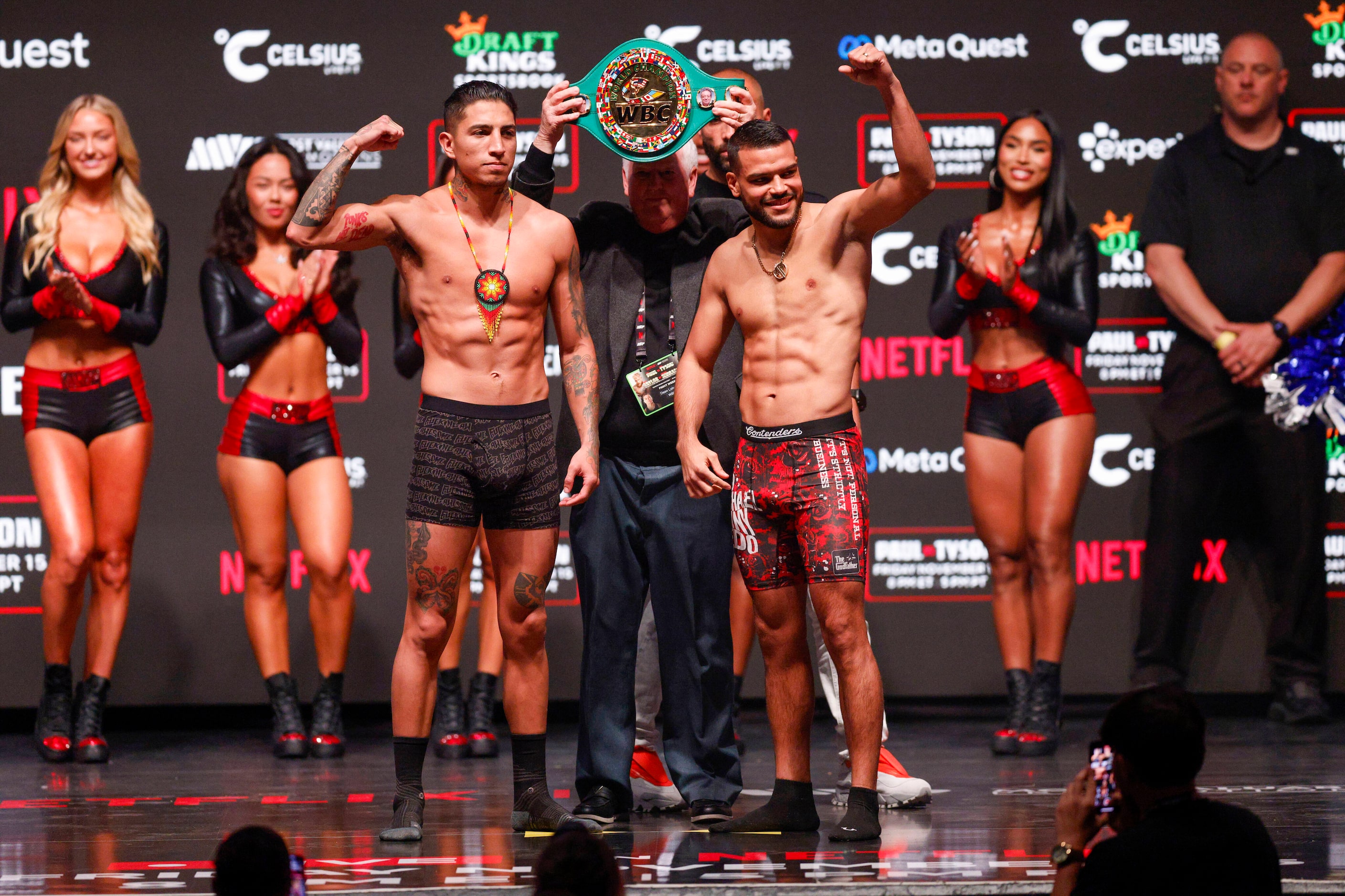 Mario Barrios (left) and Abel Ramos flex as they pose for photos during public weigh-ins...