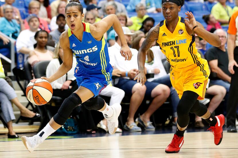 Dallas Wings guard Skylar Diggins-Smith (4) drives the ball around Indiana Fever guard Erica...