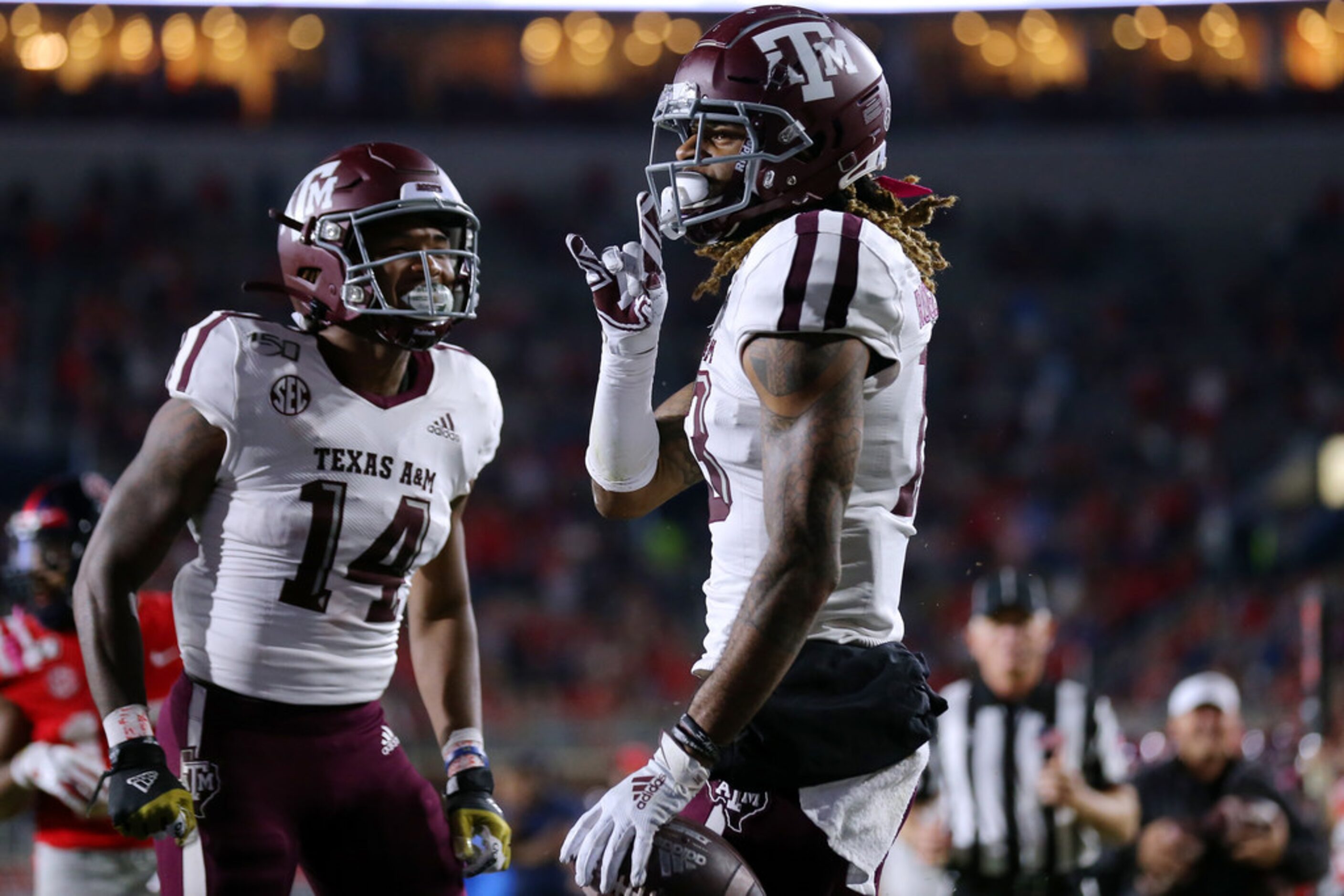 OXFORD, MISSISSIPPI - OCTOBER 19: Kendrick Rogers #13 of the Texas A&M Aggies celebrates a...