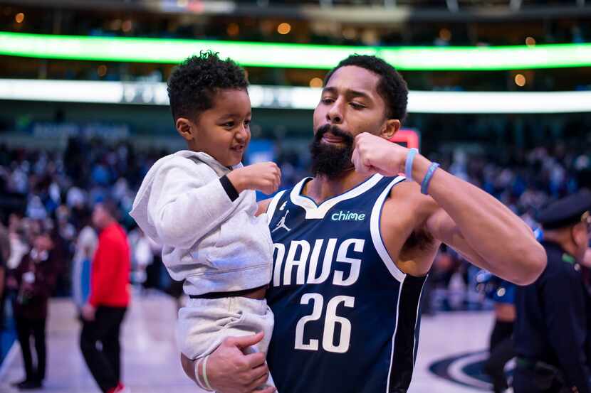 Dallas Mavericks guard Spencer Dinwiddie (26) fist-bumps his son Elijah Dinwiddie, 4, after...