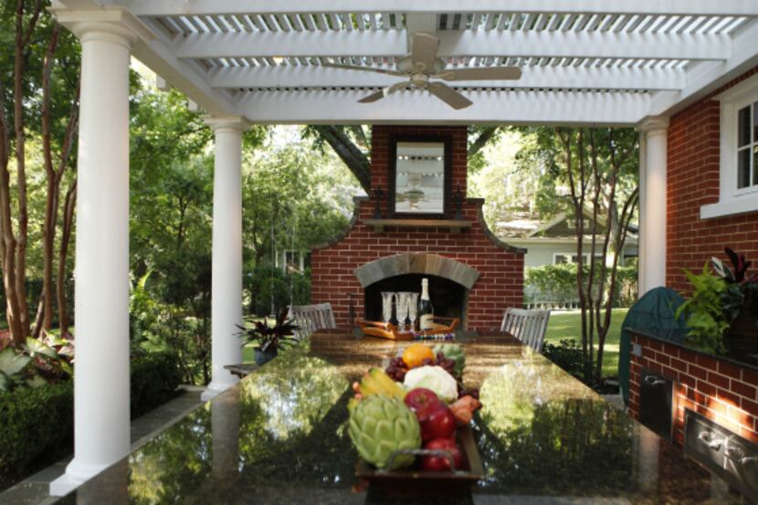 The backyard of Dr. Lynn and Edna Rodgers at their home in McKinney, Texas features a four...