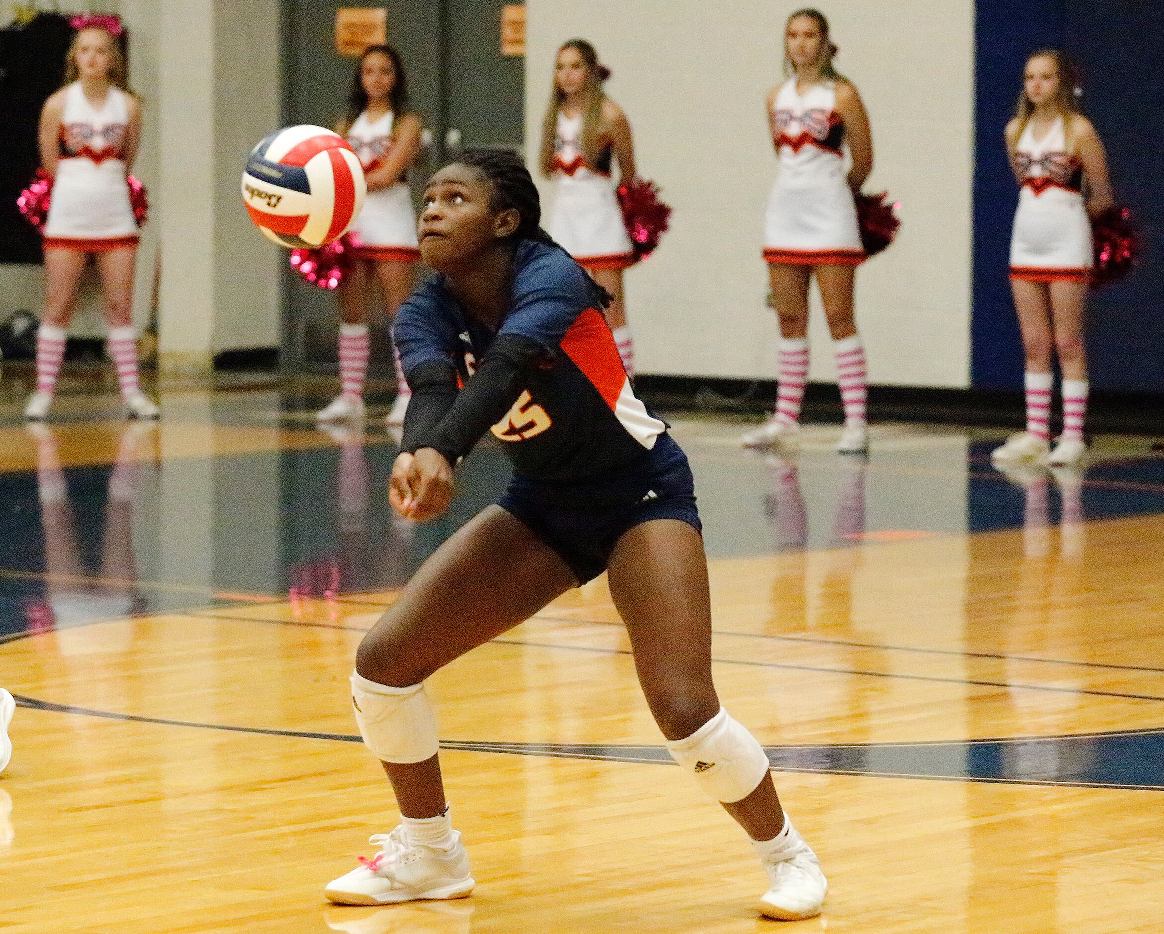 Sachse High School defensive specialist Zoria Heard (25) passes the volleyball during game...