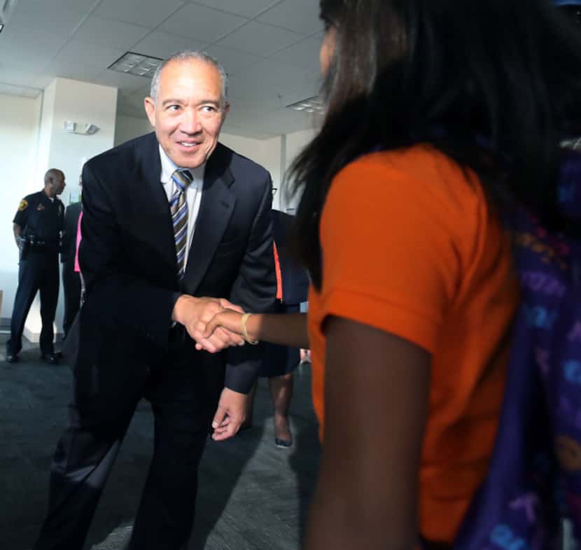 DISD Superintendent Mike Miles shook hands with a student as he toured Billy Earl Dade...