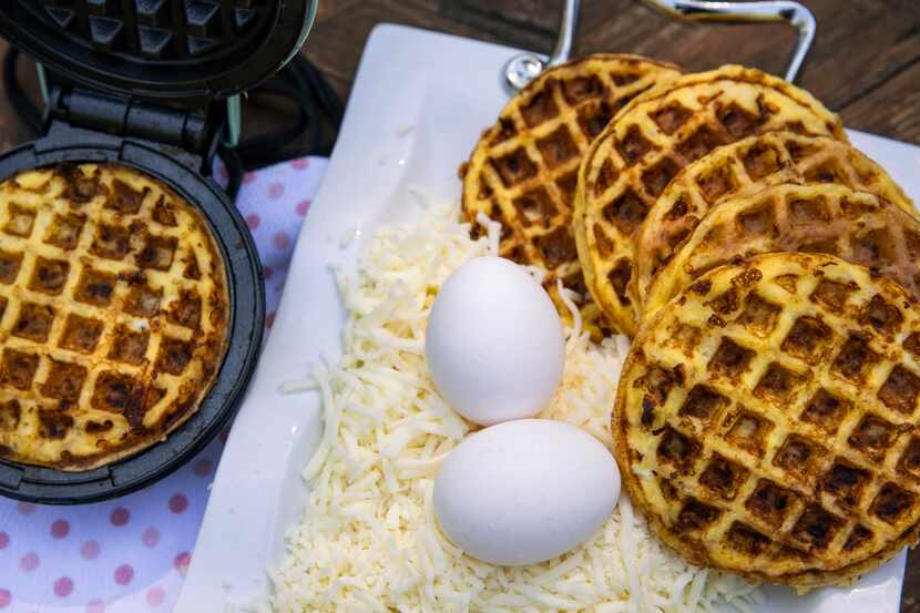 Basic chaffles, cooked in a mini waffle maker, are made solely with eggs and cheese.