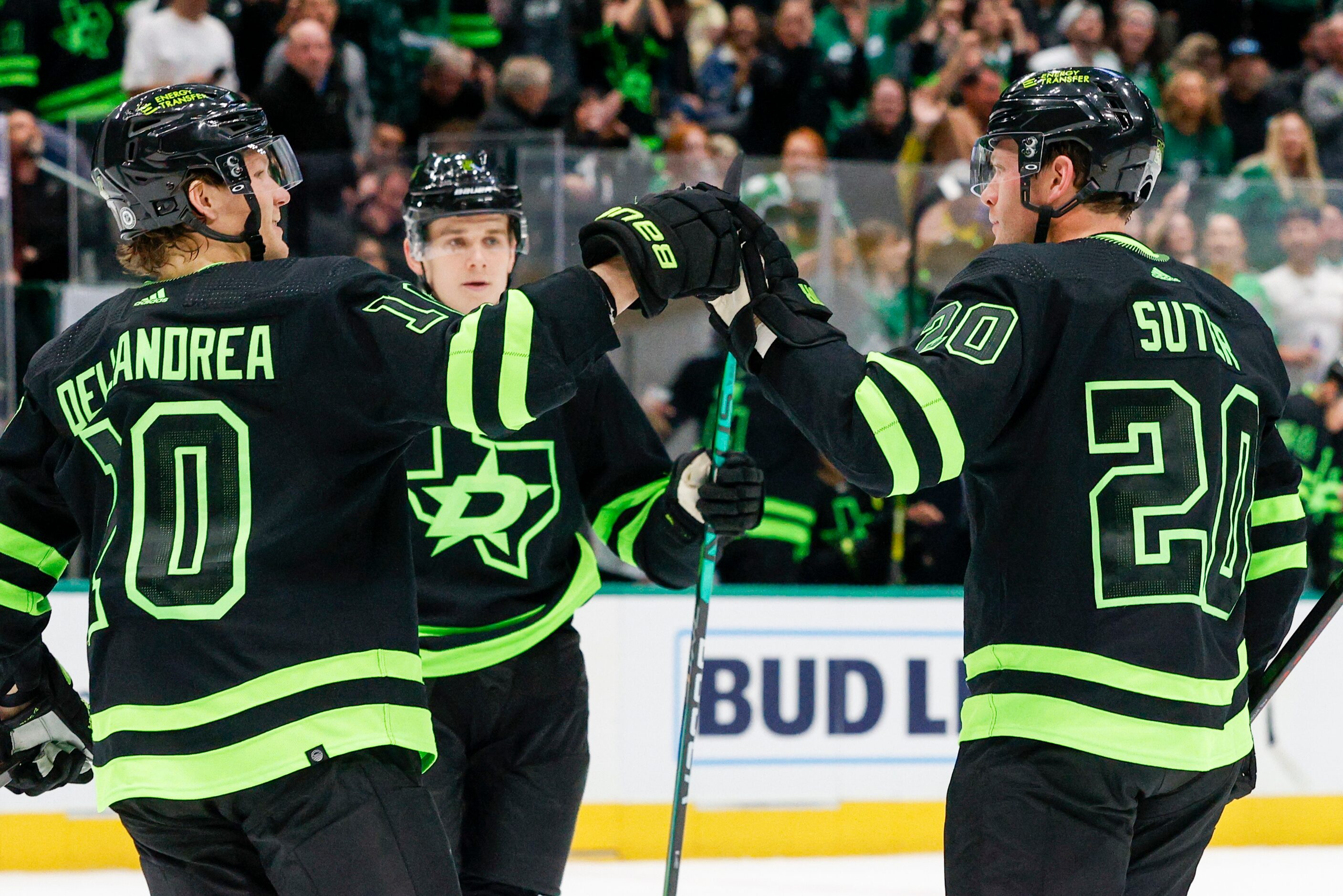 Dallas Stars defenseman Ryan Suter (20) celebrate his goal with center Ty Dellandrea (10)...