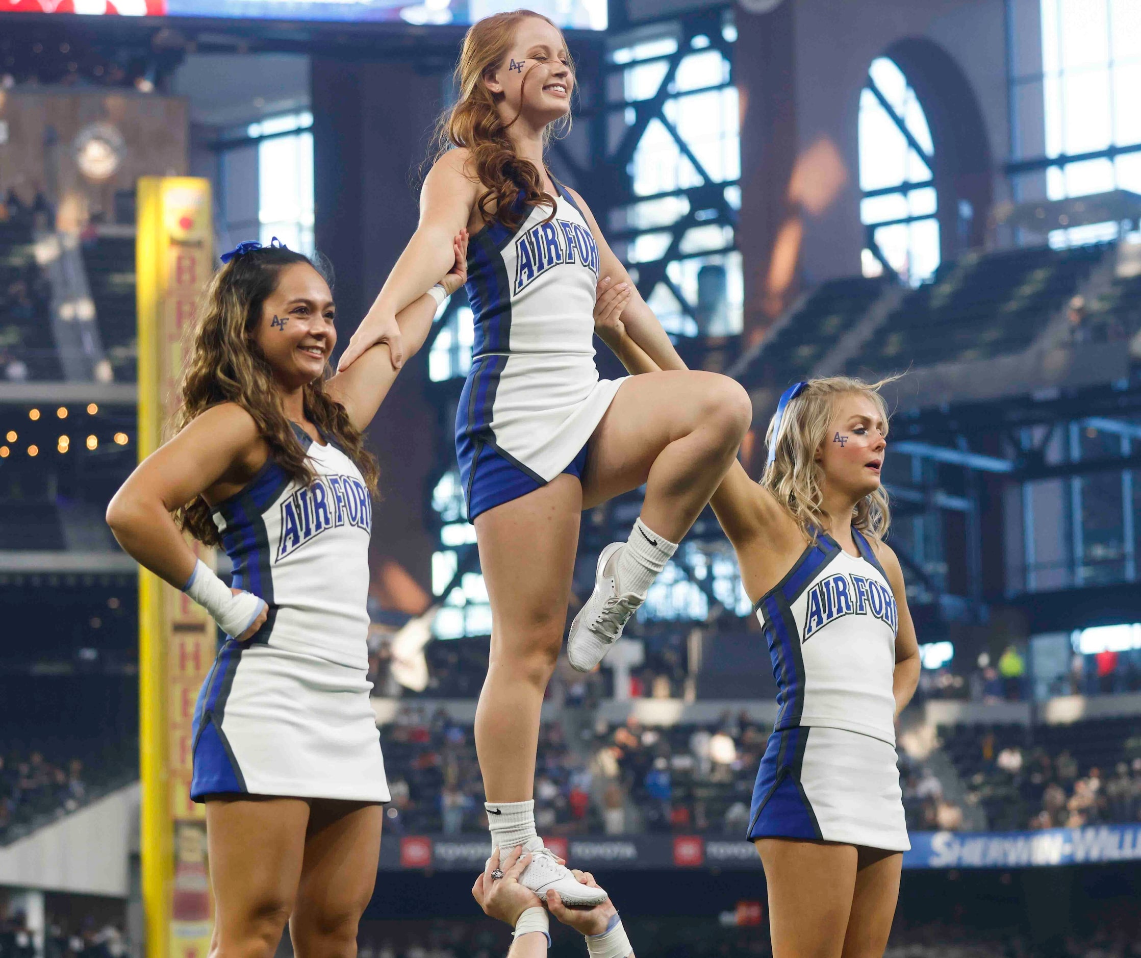 Air Force cheerleaders perform during the first half of an NCAA football game against Army...