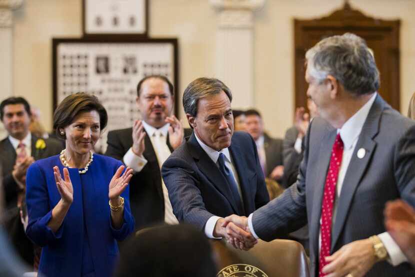  Julie Straus looks on as Rep. Joe Straus, center, gets applause and handshakes after being...