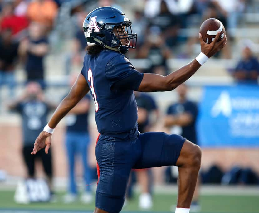 Allen High School quarterback Mike Hawkins (3) runs the ball for a touchdown during the...