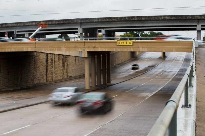 Cars drive east on Abram Street under State Highway 360 in Arlington on Oct. 31, 2018....