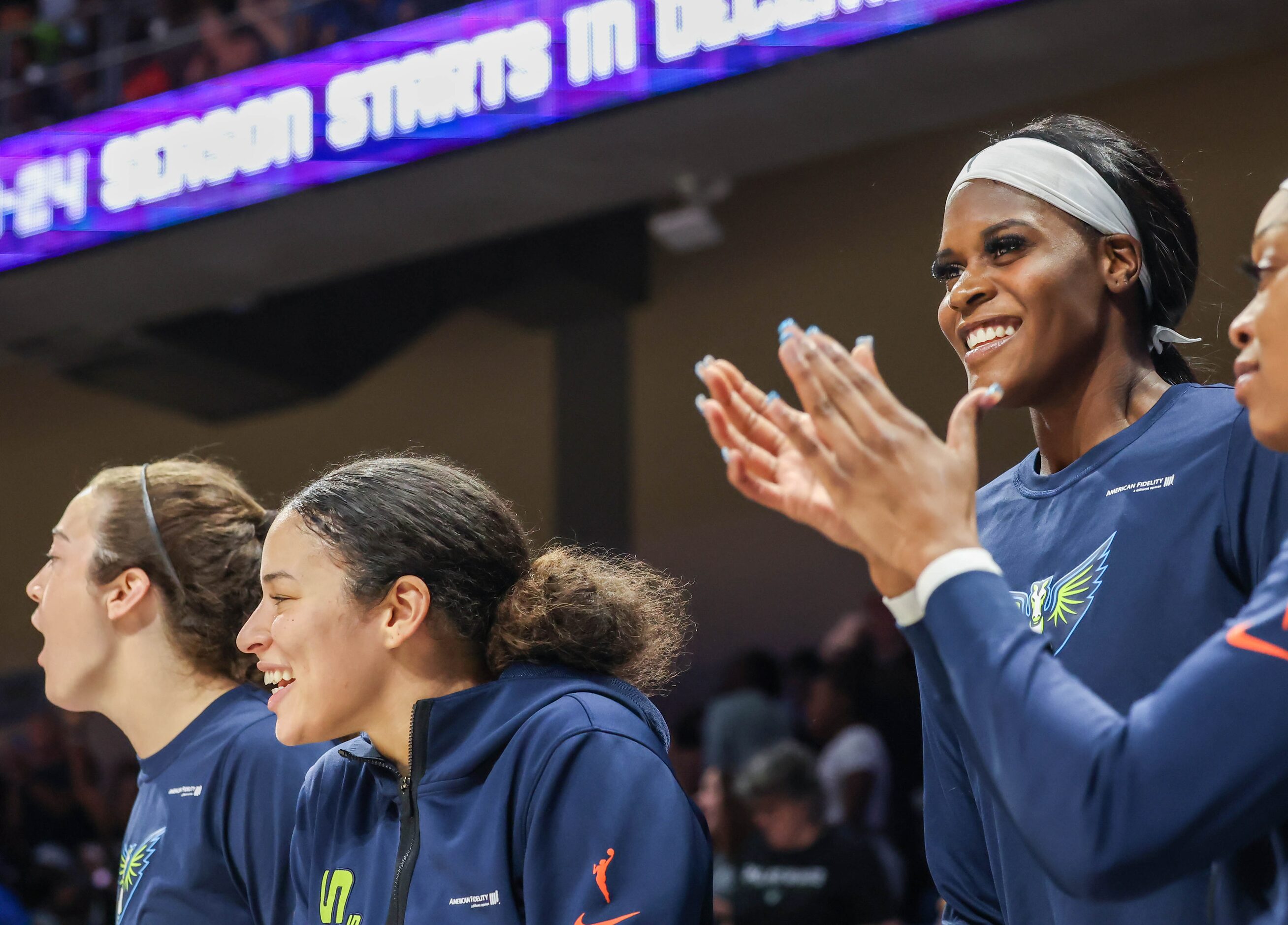 Dallas Wings forward Maddy Siegrist (20, left), guard Veronica Burton (12, center) and...