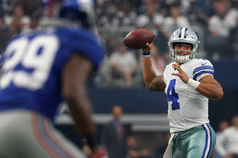 Dallas Cowboys quarterback Dak Prescott (4) looks for a receiver in the first quarter during...