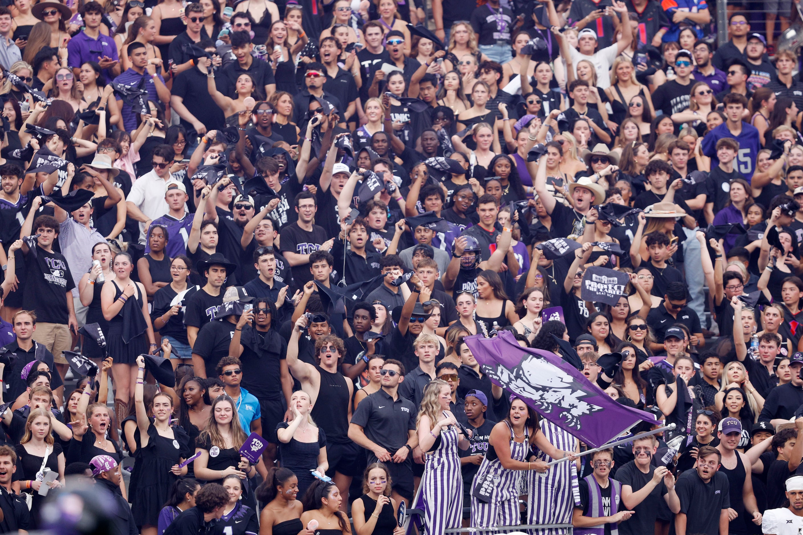 TCU fans cheer during the first half of an NCAA college football game against the UCF at...