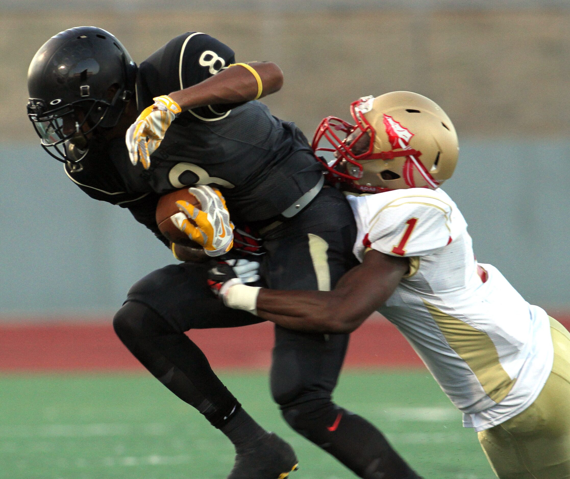 South Oak Cliff receiver Devin McCullough (8) tacks on extra yards following a reception as...