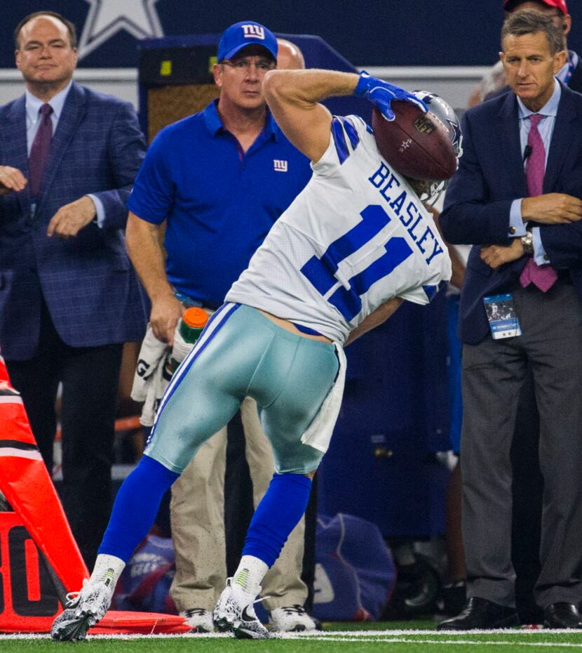 Dallas Cowboys wide receiver Cole Beasley (11) catches a pass behind his head during the...